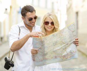 Couple looking at a map of PA travel