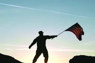 army man holds up flag
